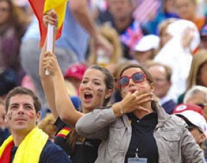 As Spanish flag bearer Alexandra Barbançon cheers for her sister Morgan