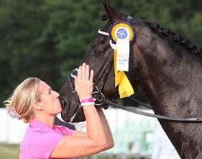 Bernadette Brune kissing Di Magic, who won the consolation finals at the 2012 World Young Horse Championships in Verden, Germany