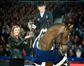 Helen Langehanenberg and Damon Hill NRW receiving the trophy from Heather Schmidt of Reem Acra after victory in the sixth leg of the World CupWestern European League series at Amsterdam :: Photo © Arnd Bronkhorst