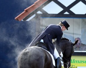One of my favourite photos of the show: Nathalie zu Sayn-Wittgenstein pats Fabienne at the end of her ride. Morning freezing temperatures show the steam coming off Fabienne