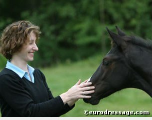 Marne Martin-Tucker patting a foal at Gut Fuchtel in Vechta