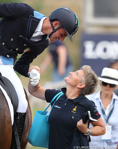 A loving and proud smile and high five between Filippo di Marco and his mom, Italian Grand Prix rider Nausicaa Maroni