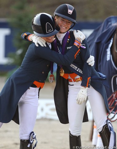 Dutch team mates Febe and Esmee hug on the podium
