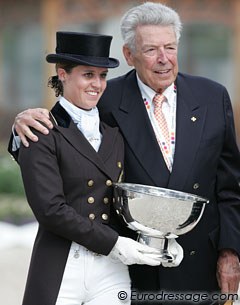 Julie de Deken wins the Aachen Under 25 Competition and receives the trophy from its sponsor Klaus Rheinberger, widower of Liselotte Linsenhoff whose horse Piaff  was used to name the Piaff Forderpreis in Germany