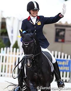 British pony rider Maisie Scruton waves to the crowds
