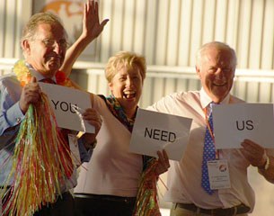 Judges Gustaf Svalling, Ricki MacMillan & FEI vet Grant Poolman were very competitive and tried to bribe the panel with their sign "you need us" in the hula hoop competition at 2013 CDI Orange