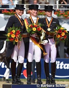 The Grand Prix Special podium: Dorothee Schneider, Isabell Werth, Kristina Sprehe