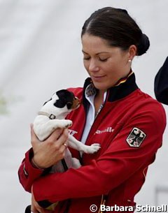 Kristina Sprehe cuddling a puppy
