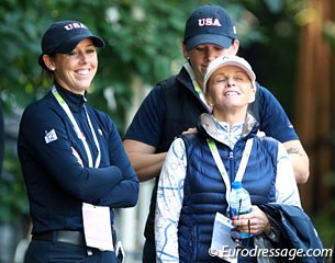 Kasey Perry-Glass with her groom Holly Gorman giving team trainer Debbie McDonald a shoulder rub 