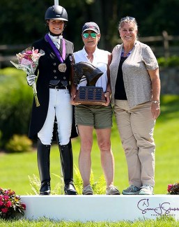 The Dressage Style Award and The Fiona Baan Memorial Trophy recipient Callie Jones with Roberta Williams (center), USDF FEI Junior and Young Rider Committee Chair, and Katherine Robertson, USDF Education Department Manager (right) :: Photo © Sue Stickle