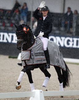 Frederic Wandres and Zucchero in a rainy lap of honour at the 2019 World Young Horse Championships :: Photo © Astrid Appels