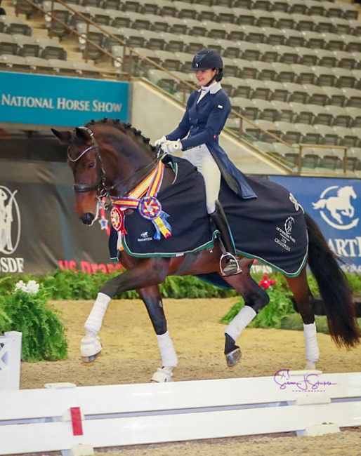 Nora Batchelder and Fifi MLW enjoy their victory lap for the Prix St. Georges Open Championship at the 2018 US Dressage Finals :: Photo © Sue Stickle