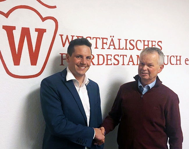 Chair Ralf Johanshon congratulates Philipp Klingbeil (left) on his appointment as Breeding director of the "Westfälischen Pferdestammbuch" in Munster