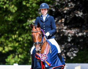 Michele Bondy and Sonnenberg's Kain win the 4-yo division at the 2019 U.S. Dressage Championships :: Photo © USEF