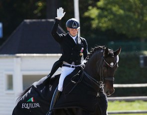 Nicolas Wagner riding the lap of honour on his sister Charlotte Remy's Herkules at the 2019 CDI Waregem :: Photo © Astrid Appels