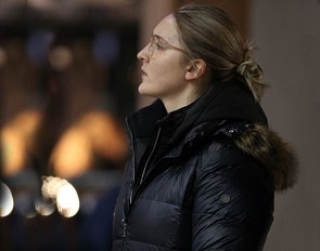 Hannah Erbe with crutches, full focus watching her sisters compete at the 2020 CDI Lier :: Photo © Astrid Appels