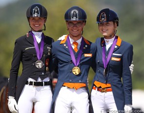 Lia Welschof, Marten Luiten and Daphne van Peperstraten on the individual podium at the 2020 European Young Riders Championships :: Photo © Astrid Appels