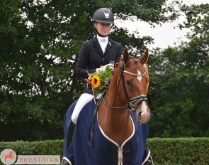 For sale in the 2021 Ekestrian Elite Dressage Auction: Quaterback filly out of Weihegold, in foal to So Perfect