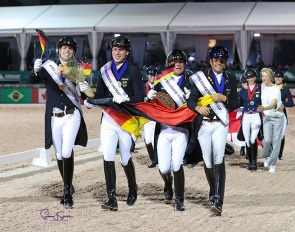 Team Germany (Wandres, Ligus, Klimke, Koschel) in their lap of honour after winning the FEI Nations Cup at the 2022 CDIO Wellington :: Photo © Sue Stickle