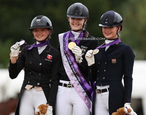 Sophia Obel Jorgensen, Allegra Schmitz-Morkramer, and Annabella Pidgley on the individual test podium at the 2022 European Junior Riders Championships :: Photo © Astrid Appels