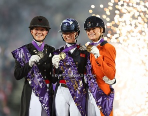 Cathrine Dufour, Charlotte Fry and Dinja van Liere on the Kur podium of the 2022 World Championships Dressage :: Photo © Astrid Appels