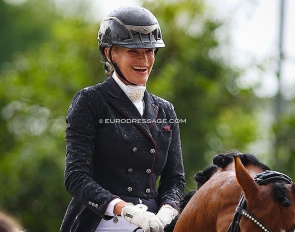 Yara Reichert in the rainy prize-giving ceremony at the 2021 World Young Horse Championships :: Photo © Astrid Appels