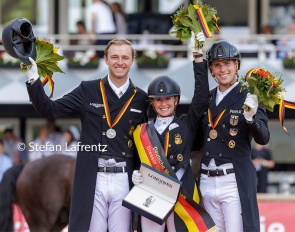 Sönke Rothenberger, Jessica von Bredow-Werndl, Frederic Wandres on the podium at the 2023 German Dressage Championships in Balve :: Photo © Stefan Lafrentz