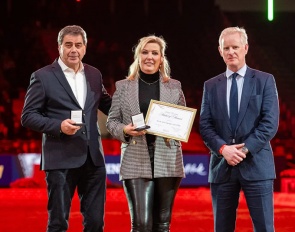 Gert-jan and Anne van Olst with British Equestrian CEO Jim Eyre at the medal ceremony at the 2023 CDI-W London