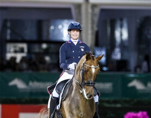 Anna Marek and Fayvel competing under floodlights at the 2024 CDI-W Wellington :: Photo © Sue Stickle