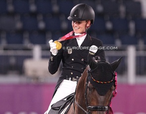 Jessica von Bredow-Werndl looking at her Tokyo Olympic gold medal :: Photo © Astrid Appels