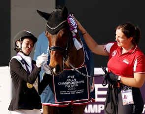 Laurentia Tan of Singapore celebrates with Hickstead after winning gold during the para dressage freestyle individual championship :: Photo © FEI/Yong Teck Lim