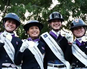 Pakjira Thongpakdi, HRH Princess Sirivannavari Nariratana Rajakanya Mahidol, Chanjanok Klara Ruecker and Nynn Puttisombat of Thailand celebrate after winning team gold during the Prix St-Georges dressage competition at the Thai Polo Club on November 25, 2025 in Pattaya, Thailand.