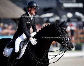 Justin Verboomen patting Zonik Plus after a winning test at the 2026 CDIO Lier :: Photo © Astrid Appels