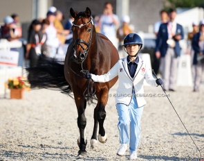 The competition's youngest competitor: Hong Kong's Kendra Li trotting up Ferati at the 2026 Asian Games :: Photo © Astrid Appels