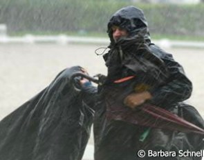 Groom runs inside, the rain has started