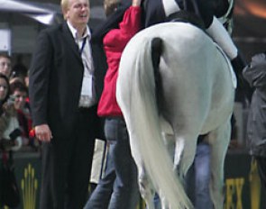 Andreas thrilled with his silver medal. He hugs Danish team trainer Rudolf Zeilinger. Esben Möller, manager of Blue Hors stud, watches and smiles.
