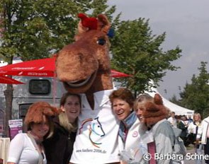 Some visitors posing with mascot Karli. Karli is so much more popular than Goleo, the lion macot of the soccer world cup