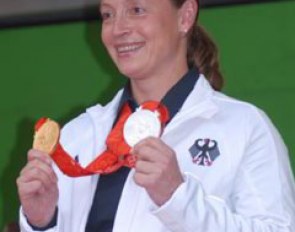 Isabell Werth with her 2008 Olympic medals: team gold, individual silver :: Photo © Barbara Schnell