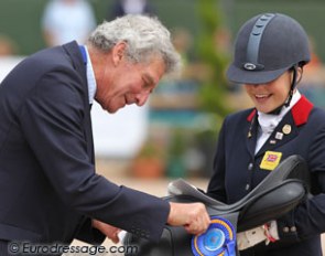 British pony rider Claire Gallimore received a saddle as prize for being the best Brit in dressage. Dr. Philip Lewis of the Worshipful Company of Saddlers (Incorporated by Charter of King Richard II in 1395) handed her the prize.