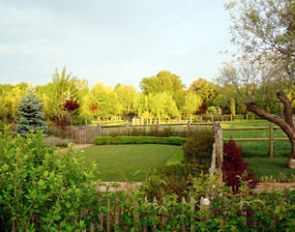 All gardens are landscaped. This one has a view on the pastures in the background