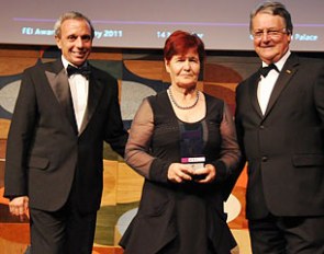 FEI Best Groom Award winner Alice Gaillard (FRA) with FEI 1st Vice-President John McEwen (right) and FEI 2nd Vice-President Pablo Mayorga (left) at the FEI Awards 2011 in Rio de Janeiro (BRA). 