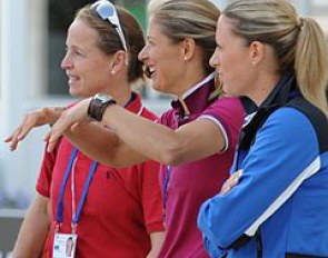 Isabell Werth, Adelinde Cornelissen, and Charlotte Dujardin at the sound check. Cornelissen is pantomiming her freestyle movemements with her arms