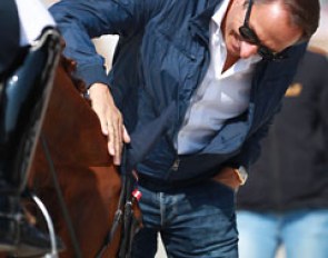 Porsche's trainer Dieter Laugks patting Florencia