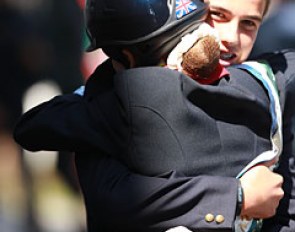 Phoebe Peters gives British eventing rider Oliver Williams a big a hug. Williams won team silver
