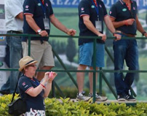 The British delegation, including youth team trainer Stephen Clarke and selector Clive Halsall, watching Charlotte Fry's freestyle