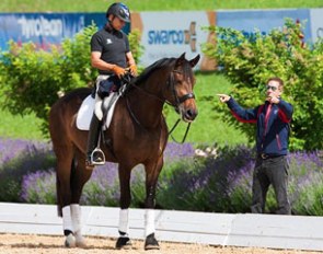 Steffen Peters on Rosamunde getting instructions from U.S. team trainer Robert Dover at the 2014 CDI Frizens in Austria