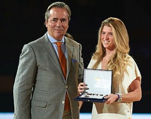 Morgan Barbançon Mestre receives the trophy as best performing and youngest Spanish rider at the 2014 World Equestrian Games during the 2014 Madrid Horse Week. 