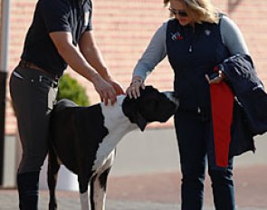 Begijnhoeve owner Rob van Puijenbroek and U.S. Dressage Director Jenny van Wieren patting Rob's Danish dog