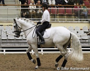Magda Pommier demonstrating the piaffe riding Tutcho in a snaffle