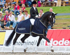 Anja Engelbart and Danciano win the 2014 Hanoverian Young Horse Championship in Verden :: Photo © Christina Beuke
